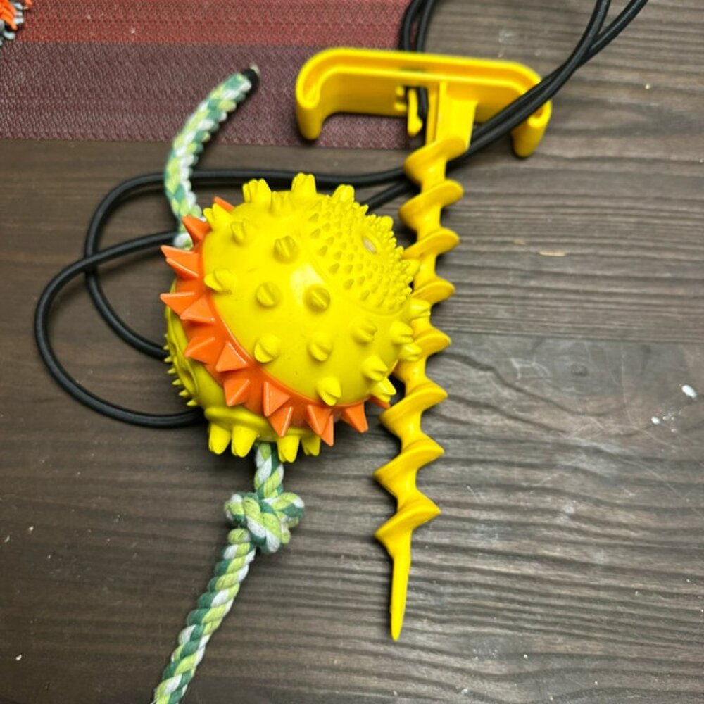 Screw in the ground dog toy